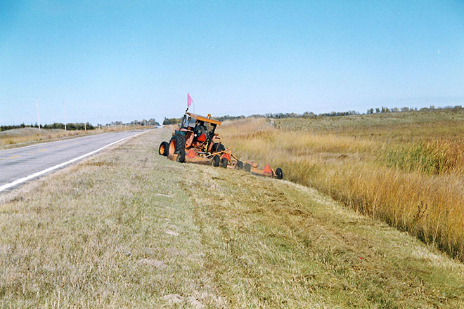 Tractor doing brush hogging